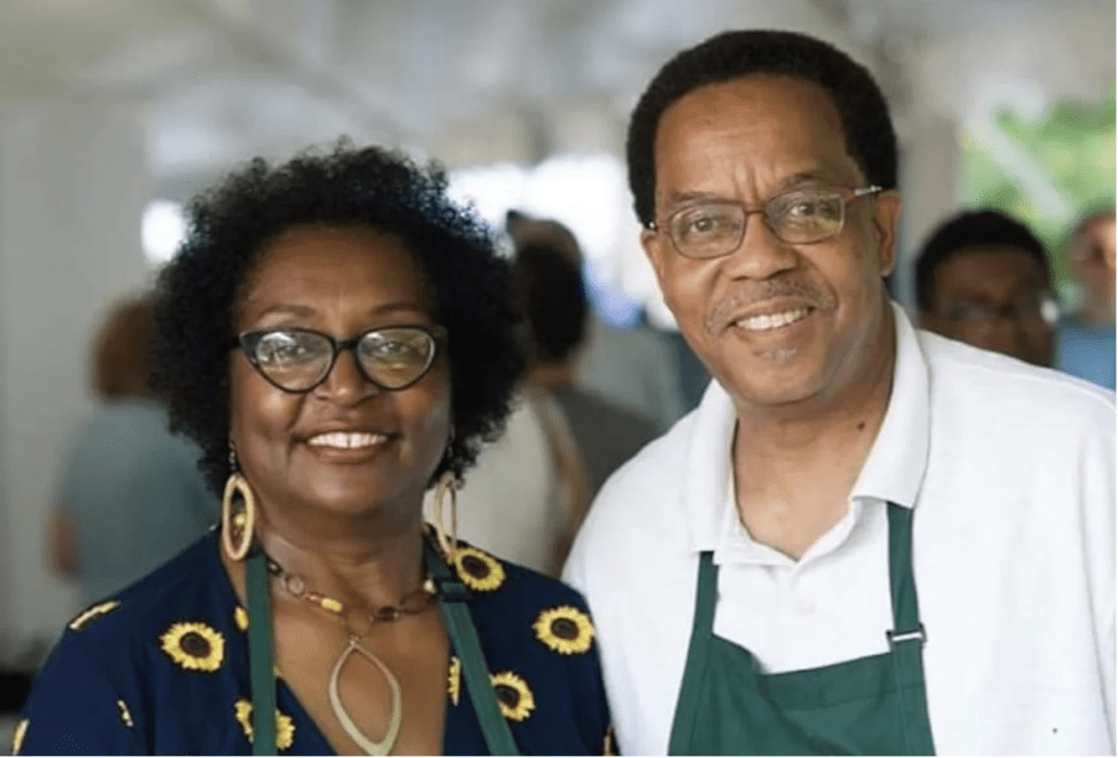 Photo - A picture of the C & W Market place owners standing in the market.